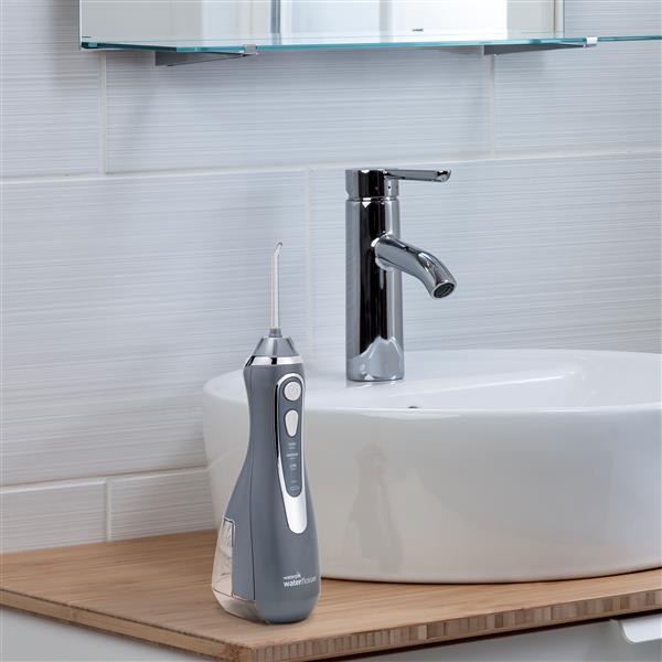 Gray Cordless Advanced 2.0 Water Flosser WP-587 In Bathroom