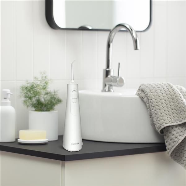 White Cordless Enhance Water Flosser WF-21 in Bathroom