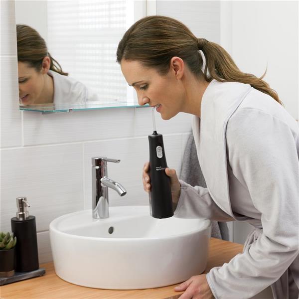 Using WF-02 Black Cordless Express Water Flosser